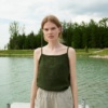 A dark green waffle linen summer top with thin straps and a high neckline