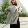 The back of pine green linen oversized button down