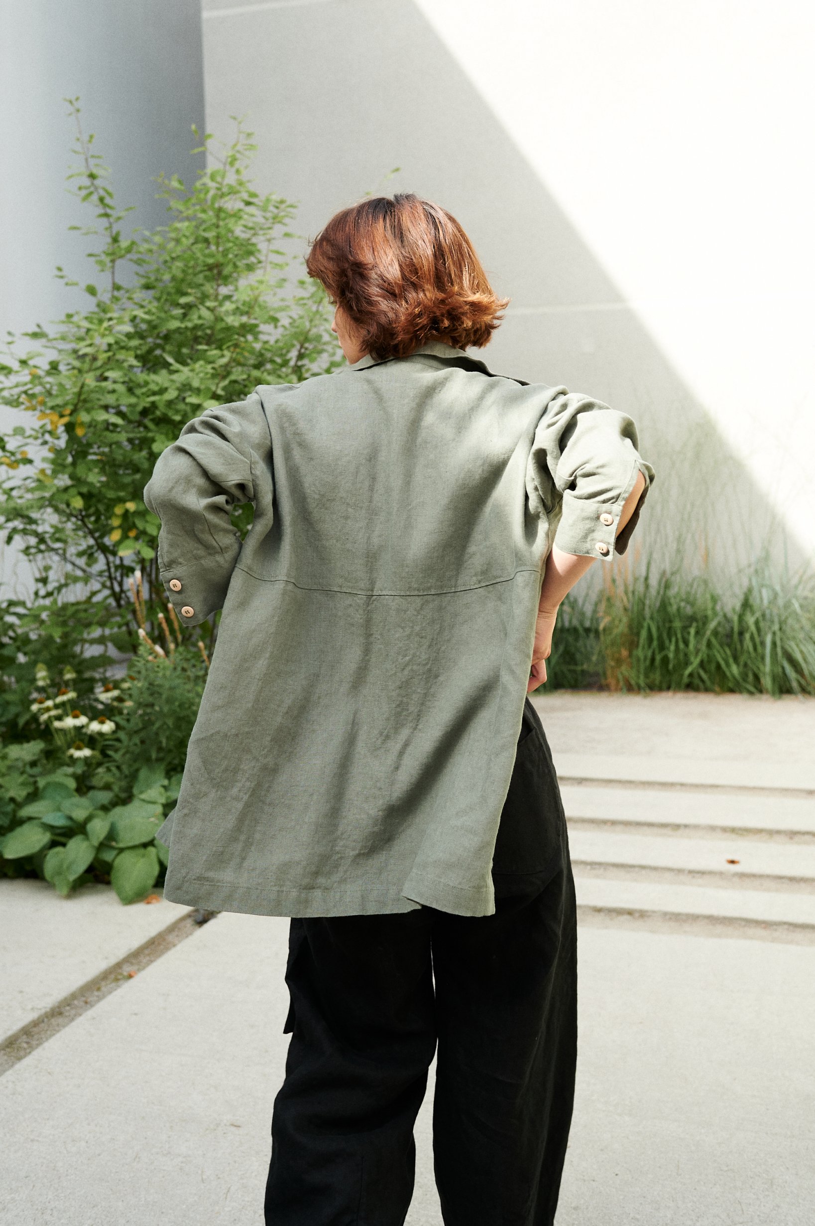 The back of pine green linen oversized button down