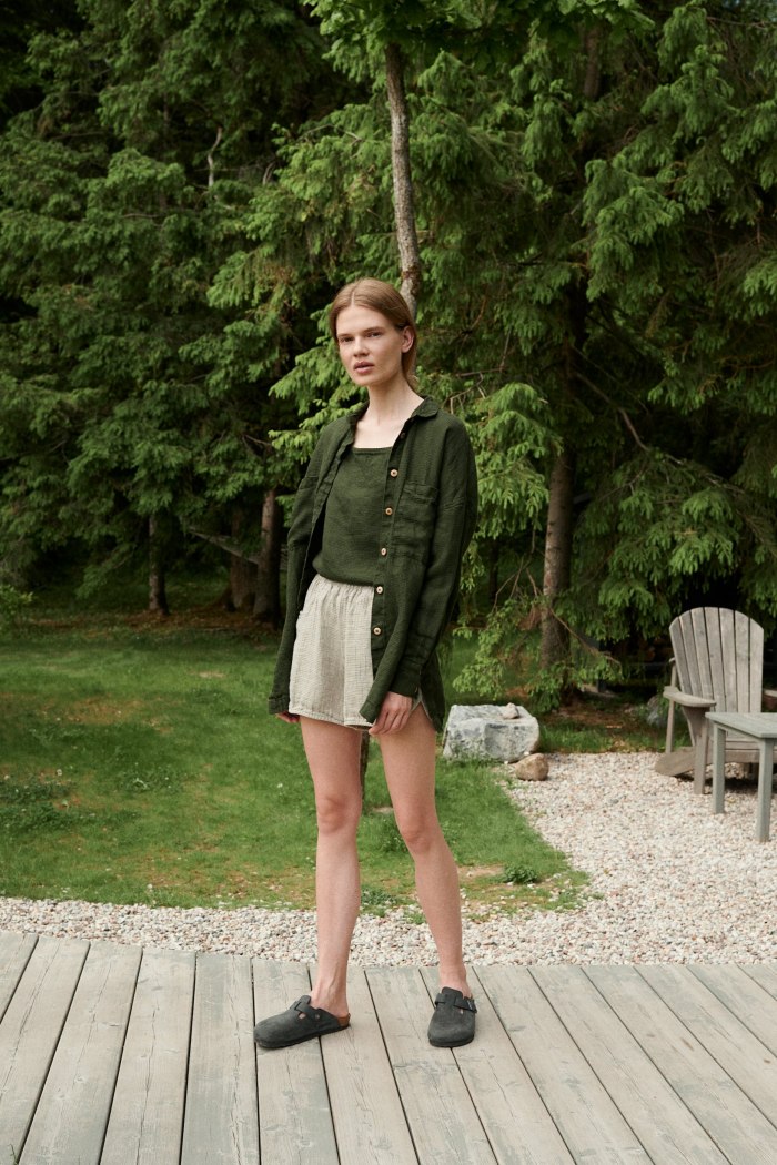 Linenfox model in an oversized green waffle linen button down shirt and wide leg waffle linen shorts outfit