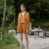 An oversized waffle linen button down shirt paired with matching shorts and linen summer top outfit