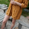 An oversized dark yellow waffle linen button down shirt with rolled up sleeves