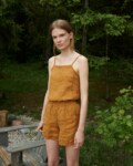 A waffle linen top with thin straps tucked into linen shorts