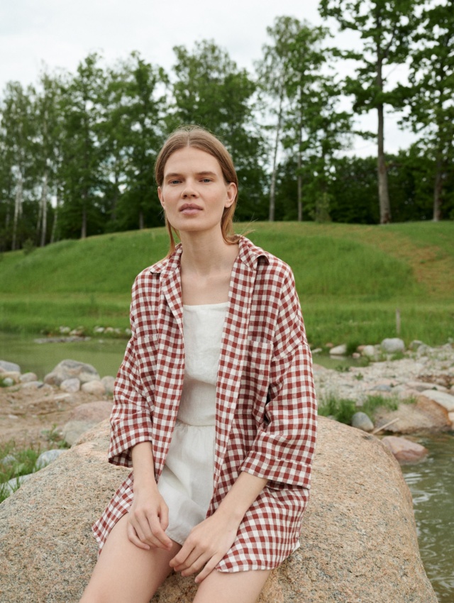 A model in brown gingham oversized linen shirt