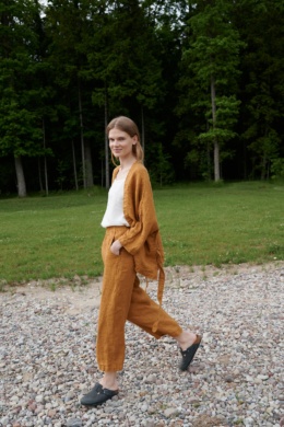 Linenfox model wearing dark yellow wide leg waffle linen pants