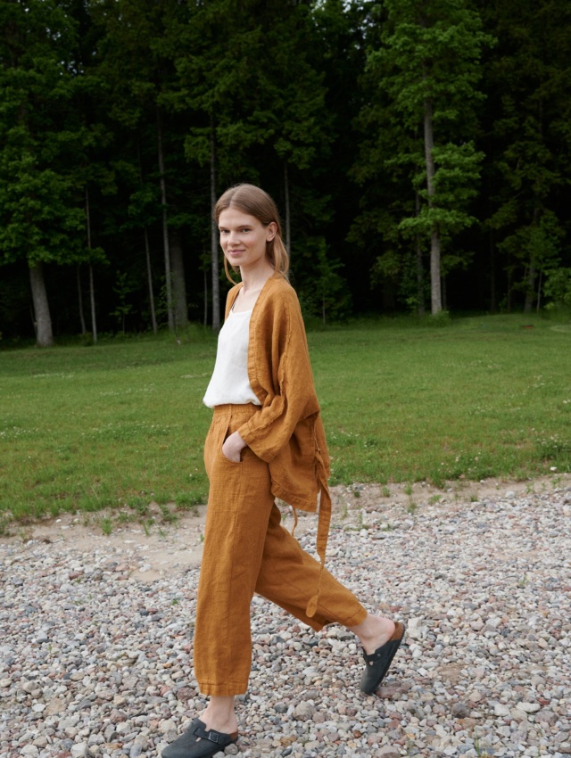 Linenfox model wearing dark yellow wide leg waffle linen pants