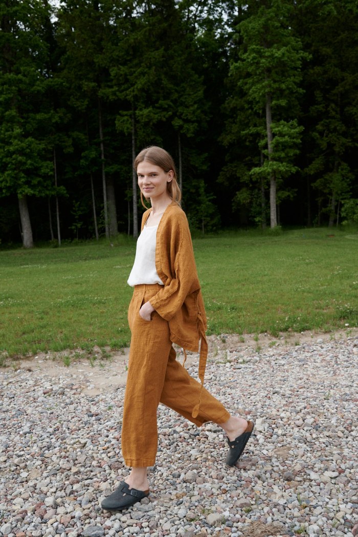 Linenfox model wearing dark yellow wide leg waffle linen pants