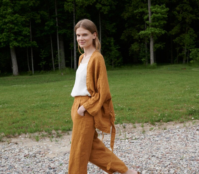 Linenfox model wearing dark yellow wide leg waffle linen pants