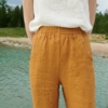 The front of high waisted trousers in camel waffle linen