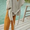 An oversized waffle linen jacket with a belt paired with wide leg linen pants
