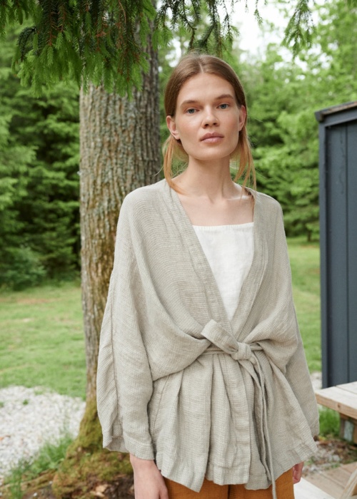 Linenfox model in an oversized waffle linen jacket with wide sleeves and a belt