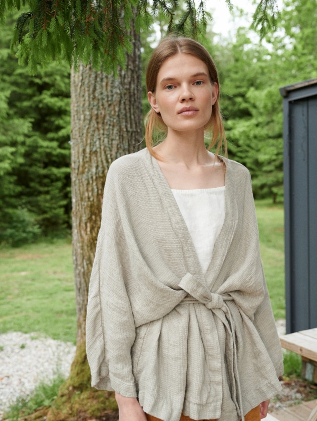 Linenfox model in an oversized waffle linen jacket with wide sleeves and a belt