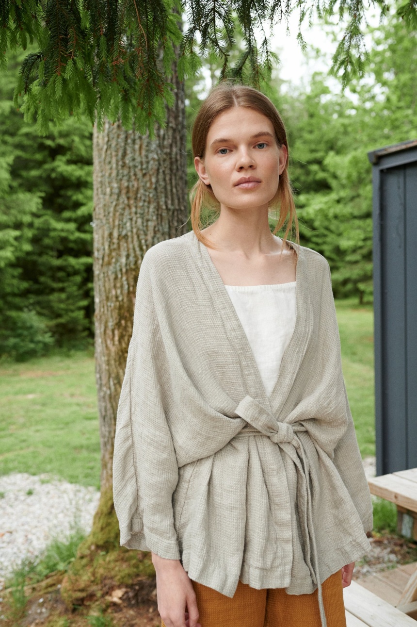 Linenfox model in an oversized waffle linen jacket with wide sleeves and a belt