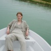 A woman in natural grey waffle linen wide leg pants