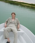 A woman in natural grey waffle linen wide leg pants