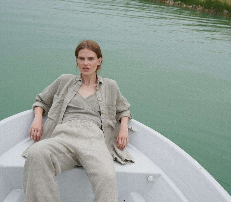 A woman in natural grey waffle linen wide leg pants