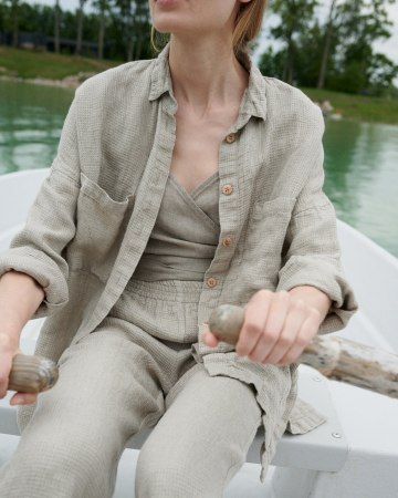 Natural grey high waisted linen trousers on a model