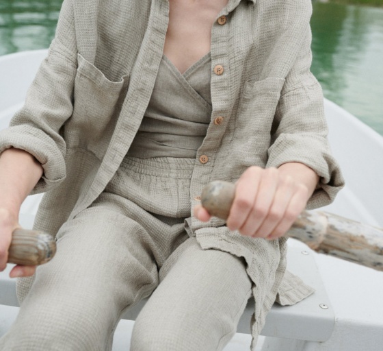 Natural grey high waisted linen trousers on a model