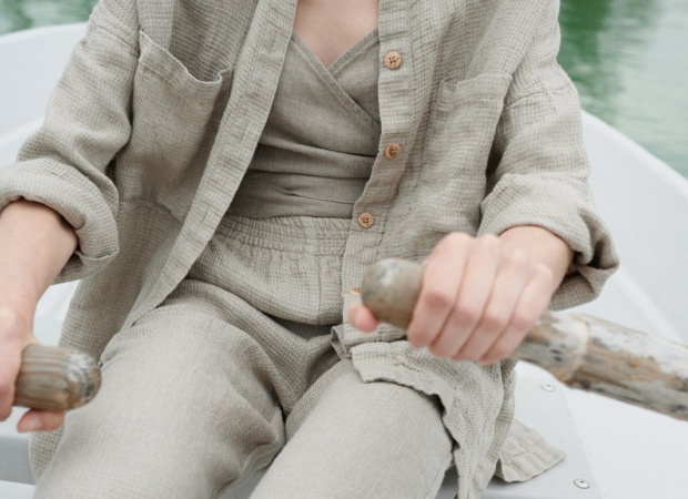 Natural grey high waisted linen trousers on a model