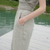 A woman wearing elasticated waist relaxed waffle linen trousers in light grey