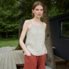 A lightweight linen top with thin straps paired with red linen shorts