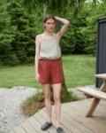 Woman wearing wide leg waffle linen shorts and a linen summer top