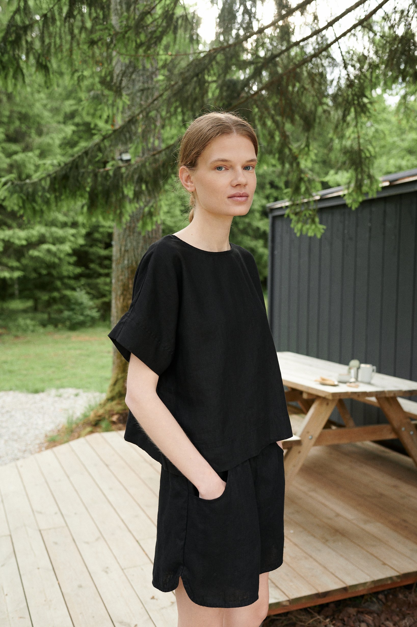 A black oversized linen top with short sleeves