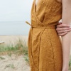 Close up of a waffle linen summer dress with a belt