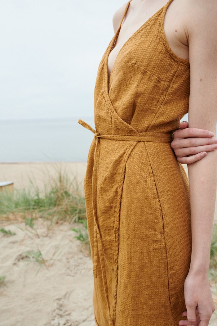 Close up of a waffle linen summer dress with a belt