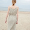 Back of a model wearing a waffle linen summer dress with thin straps