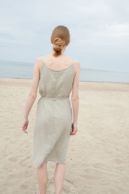 Back of a model wearing a waffle linen summer dress with thin straps