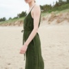 Side view of a waffle linen forest green summer dress with a belt