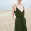 A waffle linen summer dress with thin straps and a belt