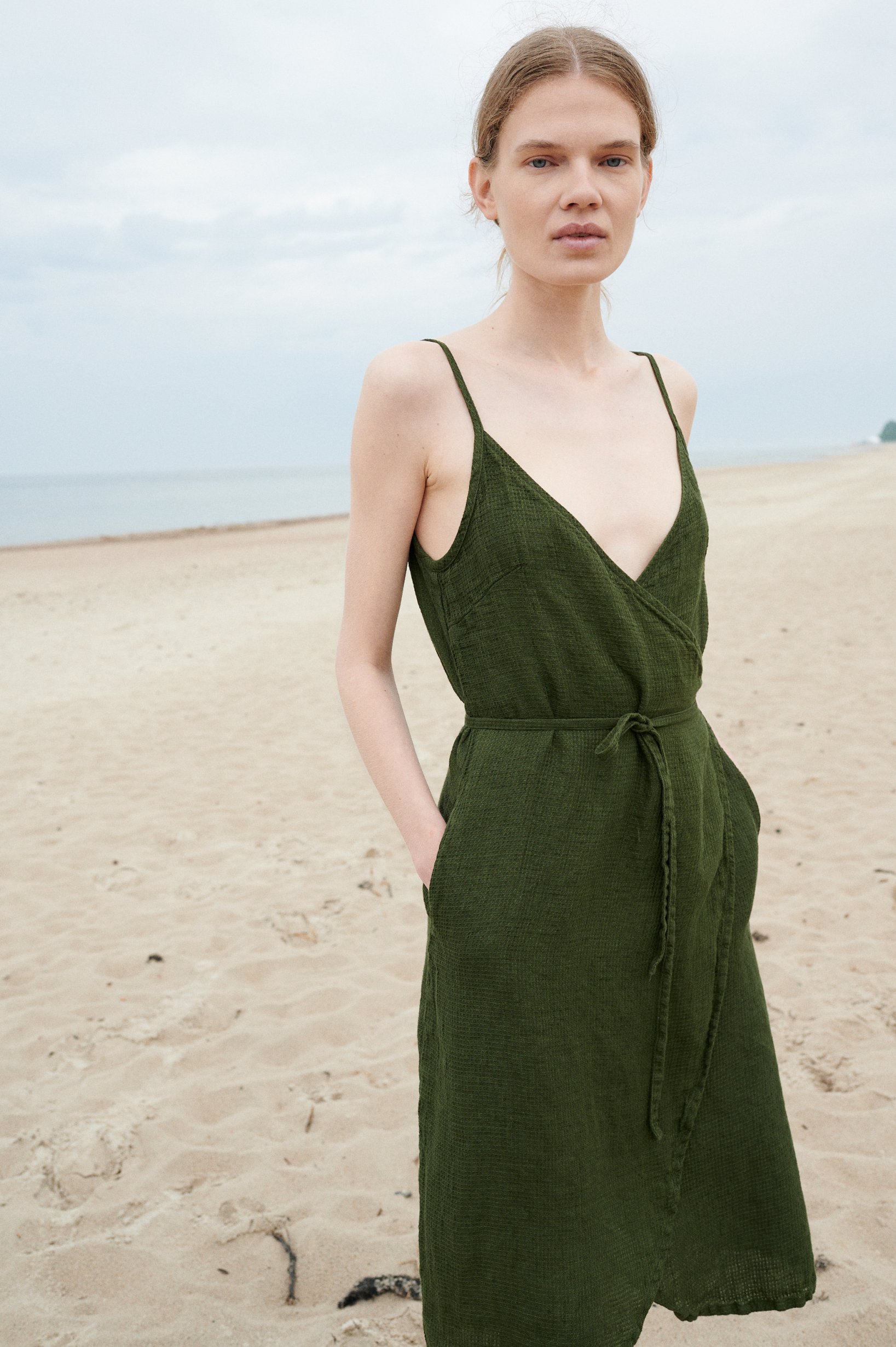 A waffle linen summer dress with thin straps and a belt