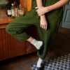 A dark green linen jumpsuit with cropped legs and slightly dropped crotch