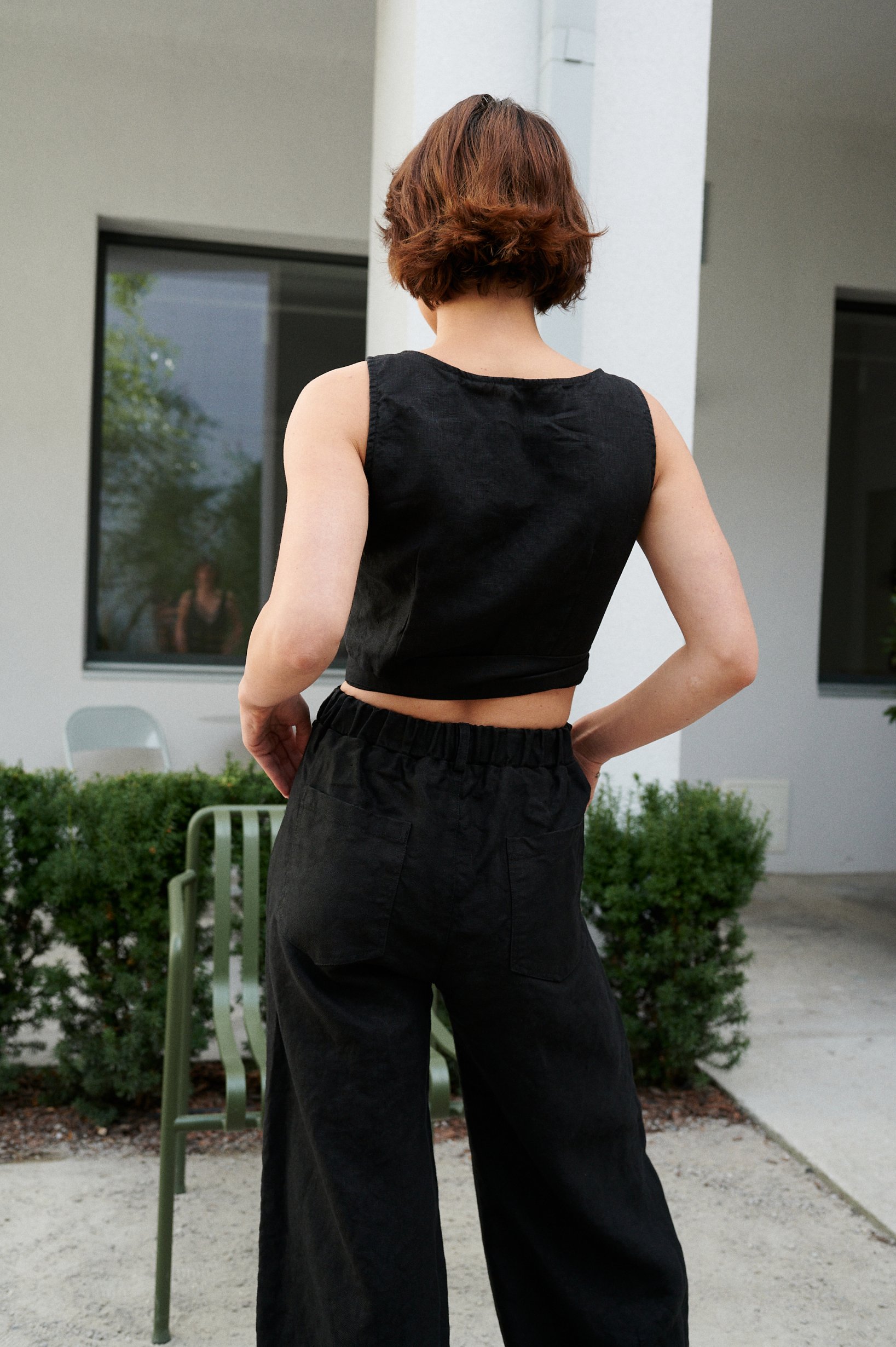 The back of high waist heavy linen black trousers
