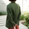 The back of green long hem shirt