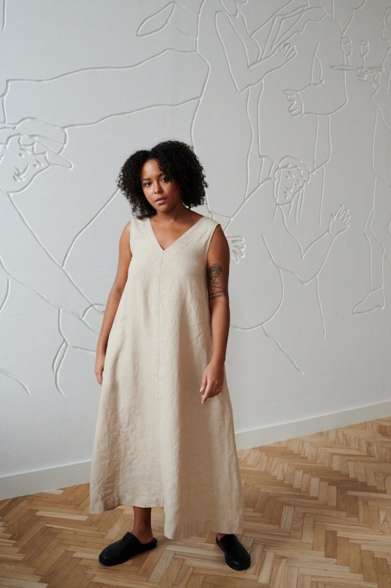 A beige linen dress in an A-line silhouette