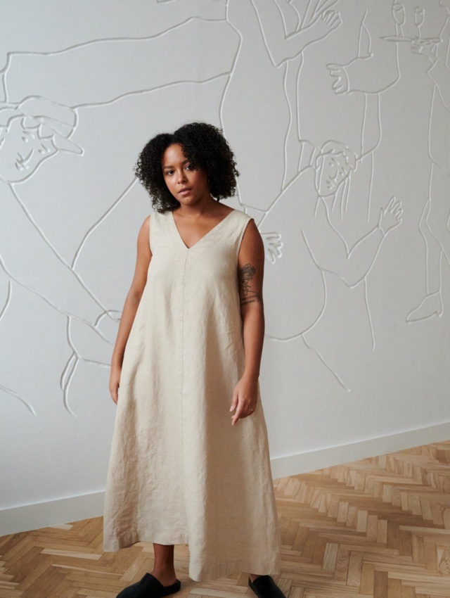 A beige linen dress in an A-line silhouette