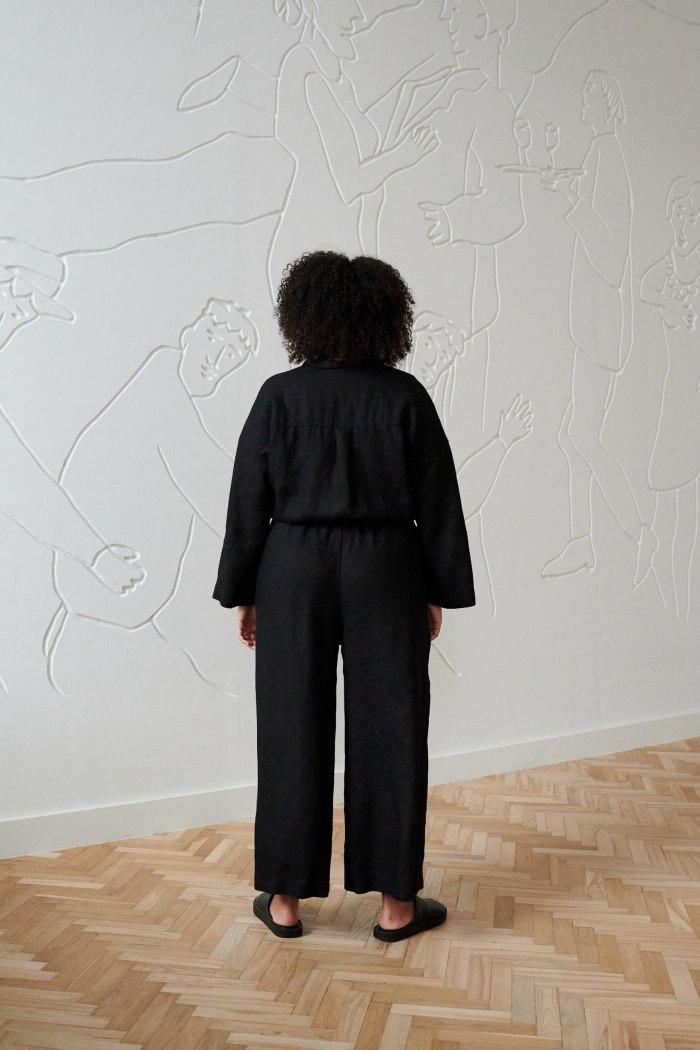 The back of black linen shirt and matching trousers