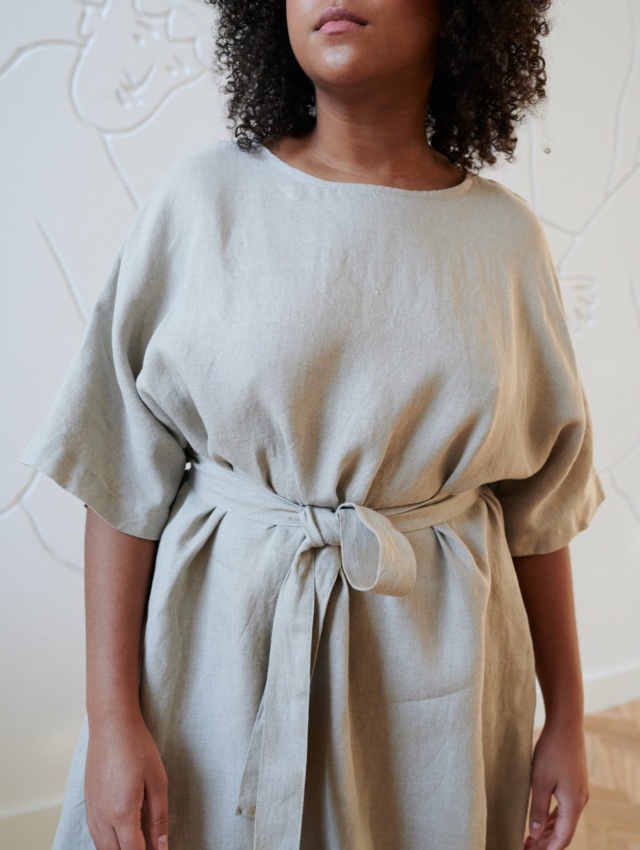 An oversized linen dress tied with a matching belt