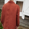 Back view of a model wearing a relaxed fit heavy linen jacket