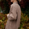 Side view of a model wearing a relaxed fit heavy linen utility jacket