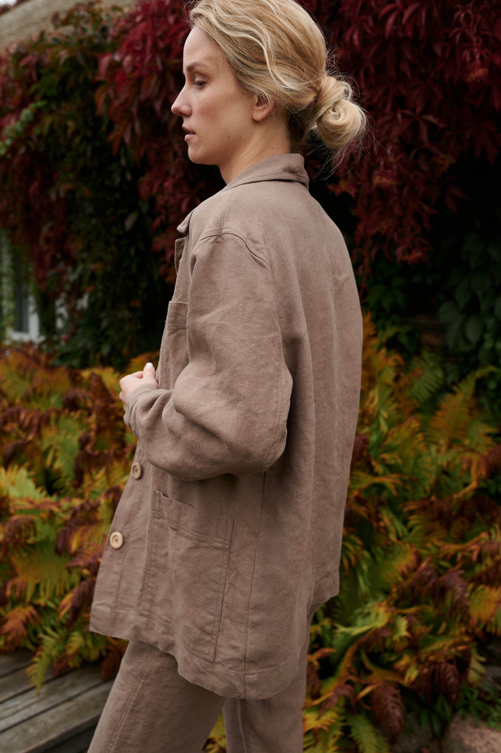 Side view of a model wearing a relaxed fit heavy linen utility jacket