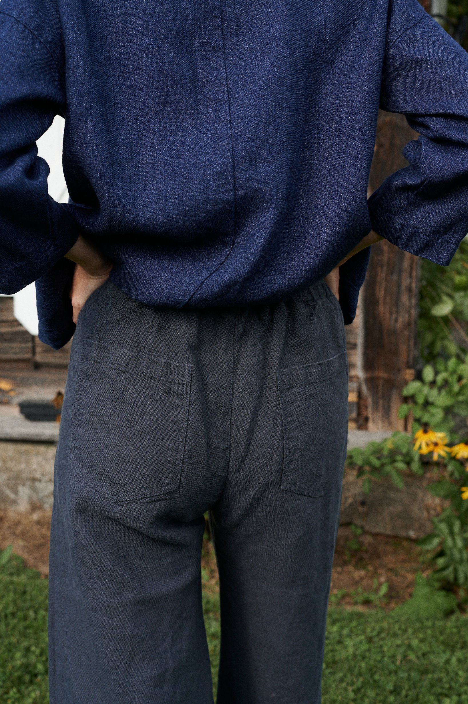 The elasticated back of graphite grey heavy linen trousers