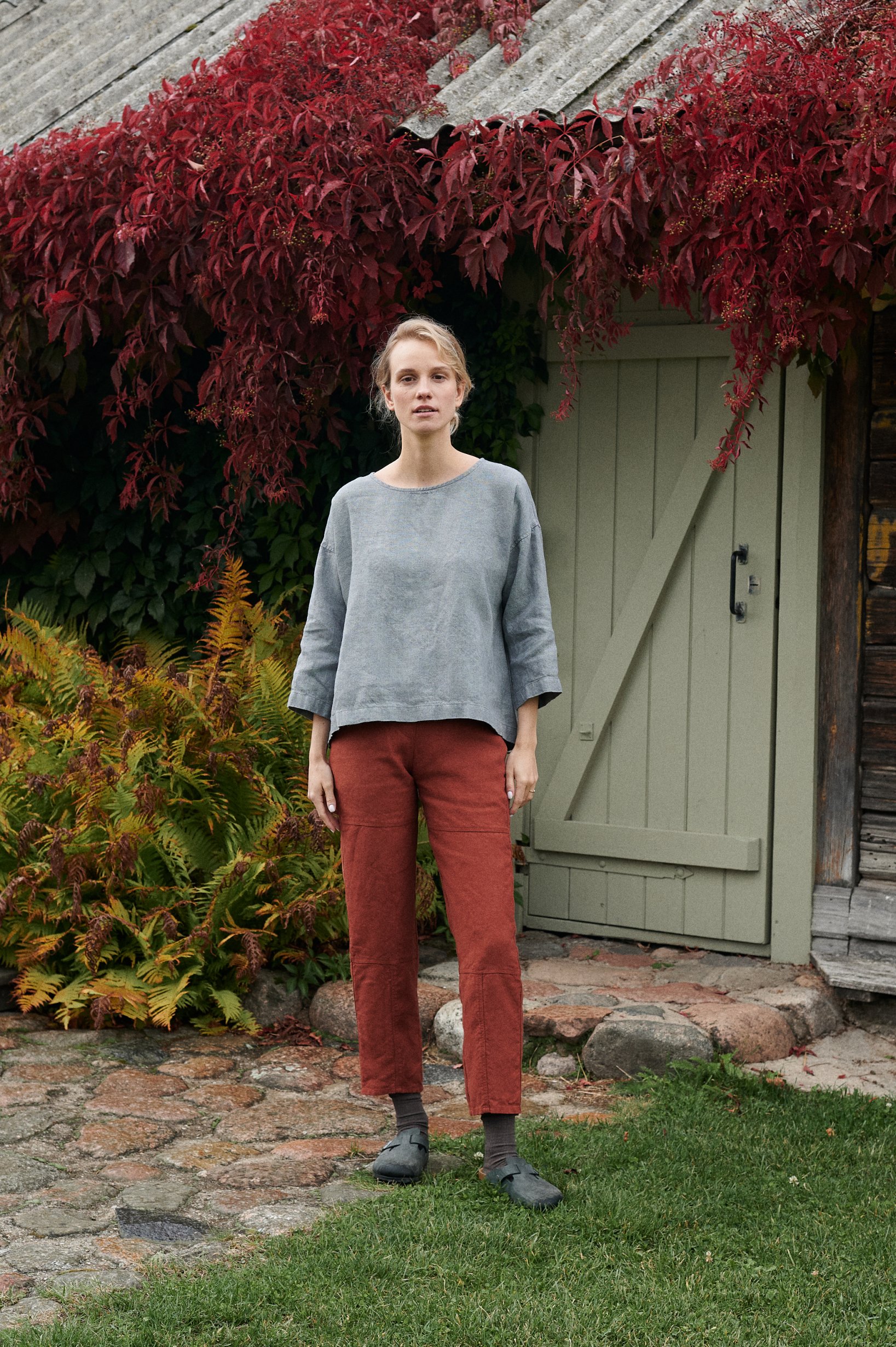 High-waisted utility trousers and a loose-fitting linen top