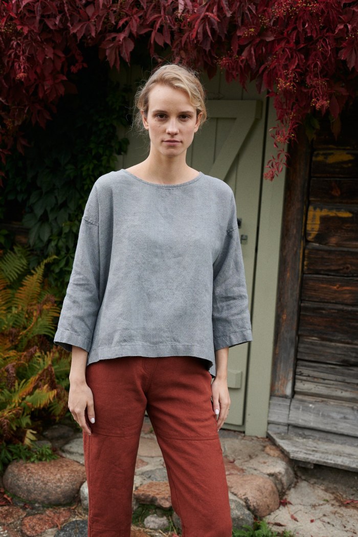 Woman in a grey linen wool blend tunic and linen pants