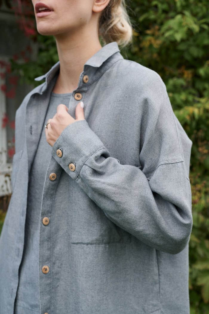 A woman in oversized linen wool blend grey shirt