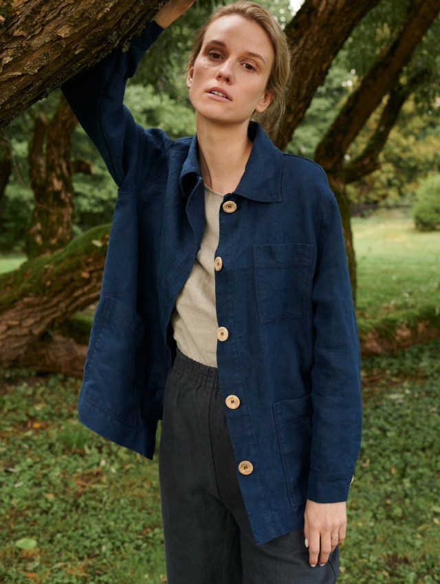 Model in blue jacket and utility linen pants set