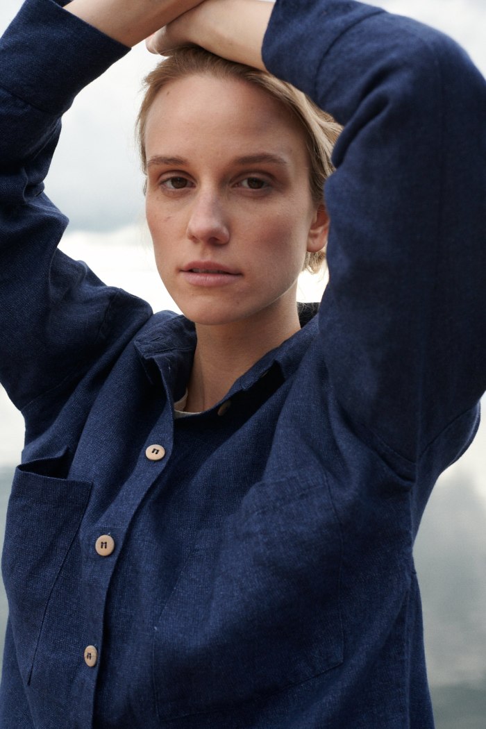 A woman in dark blue wool linen shirt
